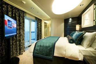 Norwegian Cruise Line Norwegian Breakaway Accommodation The Haven Deluxe Owner Suite Bedroom.jpg
